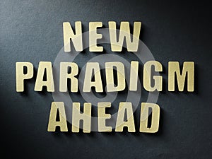 The word New Paradigm Ahead on paper background