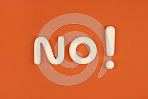 Word `no` with exclamation mark on a red background. Explicit refusal. 3d mock-up model. Denial concept. Negative reaction.