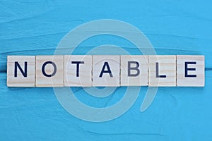 word notable made from wooden gray letters