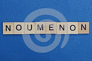 Word noumenon from small gray wooden letters
