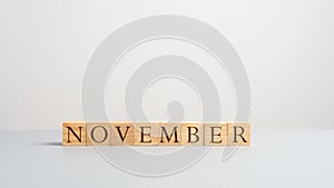 Word november on wooden cubes