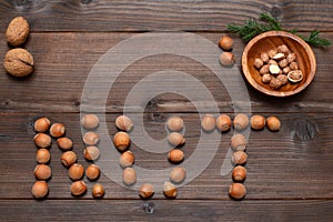 the word nut laid out from hazelnuts on the table