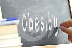 The word Obesity hand written on a blackboard.