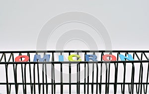The word omicron made with wooden letters photo