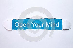 Word Open Your Mind on torn paper