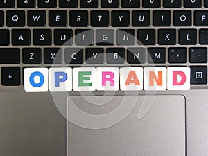 Word Operand on keyboard background