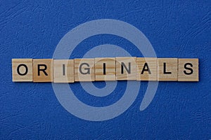 Word originals made from brown wooden letters photo