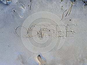 The word ostsee written in the sand