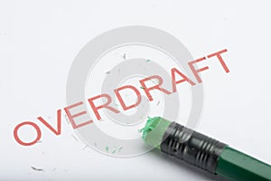 Word `Overdraft` with Worn Pencil Eraser and Shavings