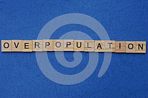 Word overpopulation made from brown wooden letters