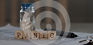 Word PANIC composed of wooden dices