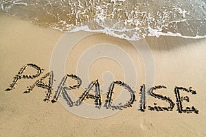Word paradise on beach