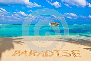 Word Paradise on beach