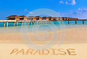 Word Paradise on beach