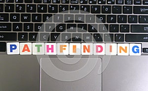 Word Pathfinding on keyboard background photo