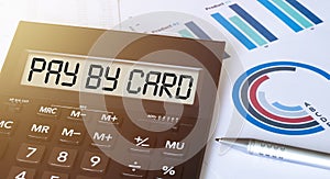 Word pay by card on calculator. Business and finance concept