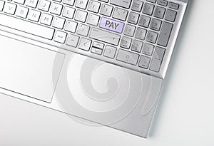 Word PAY on enter button on laptops keyboard. Online payment concept