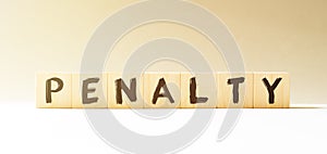 Word PENALTY made with wood building blocks
