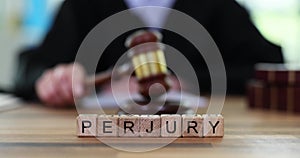 Word of perjury and judge banging his gavel on court table