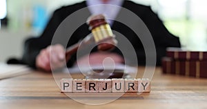 Word is perjury and judge bangs gavel in court