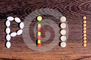 Word `pill` built with tablets