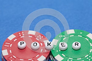 Word `POKER` with poker chips and money, gambling concept