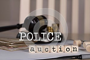 Word POLICE AUCTION composed of wooden dices