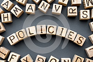 Word policies composed of wooden cubes with letters