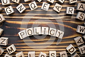 Word policy composed of wooden cubes with letters