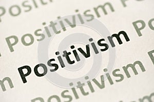 Word Positivism printed on paper macro photo