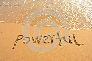 Word powerful draw on beach