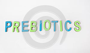 The word PREBIOTICS is written in colored wooden letters photo