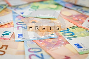 The word Preis - in German for Price - and Steigerung - in German for increase - in the background on banknotes Euro notes written photo