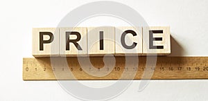 Word PRICE made with wood building blocks