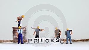 The word â€œPRICESâ€ formed with white cube.