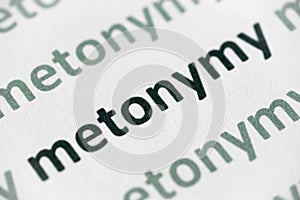 Word metonymy printed on paper macro photo