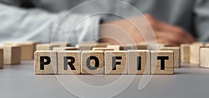 The word profit made from wooden cubes. Selective focus