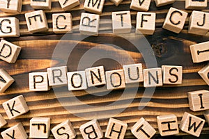 Word pronouns composed of wooden cubes with letters