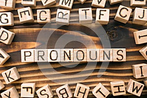 word pronouns composed of wooden cubes with letters photo
