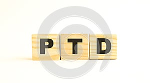 The word PTD. Wooden cubes with letters isolated on white background.