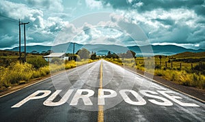 The word PURPOSE written on an open asphalt road amidst a vast landscape, invoking a sense of direction, goal setting, and