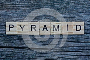 word pyramid made from gray wooden letters