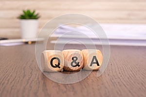 Word Q and A written on wooden cubes. question and answer concept