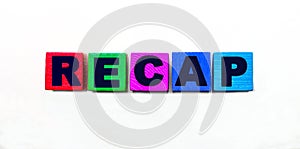 The word RECAP is written on colorful cubes on a light background photo