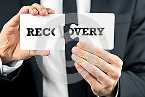 The word Recovery on puzzle pieces