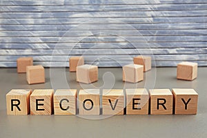 Word recovery written on wooden blocks photo