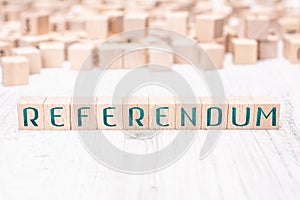 The Word Referendum Formed By Wooden Blocks On A White Table