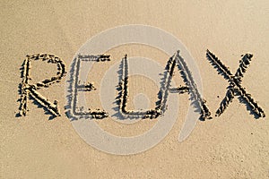 Word relax on beach