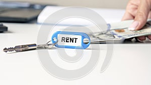 The word rent is written on the blue key fob