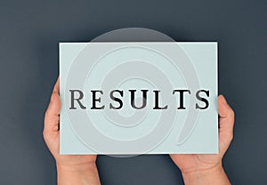 The word result is standing on a paper, business achievements, growth, marketing concept